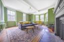 The living room in the listed apartment within Octagon Court, located on Calvert Street in Norwich, for sale at a £350,000 guide