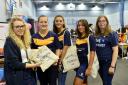 Bethany Cutter (left) helps freshers Ciara Bland, Millie Barker, Jade Craig and Sophie Ward at the University of Cumbria's Freshers Fair