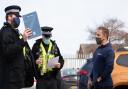 Police officers talking to gym owner Alex Lowndes outside Gainz Fitness and Strength.