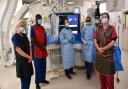 Drs Martin and Heck (middle, blue gowns) led the team during the UK first procedure at Royal Papworth Hospital.