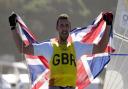 Huntingdon\'s Giles Scott celebrates his gold medal in the men\'s finn class during the sailing regatta at the Tokyo 2020 Olympic Games.