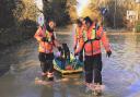 Fire crews rescue dogs submerged in flood water in St Neots on Christmas Eve.