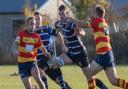 St Ives\' man of the match, Ollie Raine, bursts through a gap.