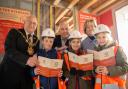 The mayor and mayoress with John Dillon from David Wilson Homes and pupils.