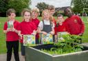 Alconbury C of E Primary School receiving their gardening equipment from David Wilson Homes.