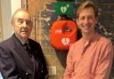 Richard Spendlove and Dan Schumann DL, founder of Viva Arts and Community Group, with the defibrillator,