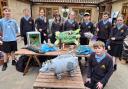 The Sawtry Village Academy pupils with their sculptures at Johnsons of Old Hurst.