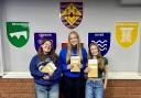 (L-R): Aimee Strong, Sophie Canning and Jessica Barker celebrating their results.