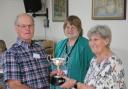 Club president Diane Briars presenting the winner's trophy to David Usher, looked on by show secretary Alison Gilbey.