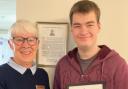 Josh Pace, 'Chief Can Crusher' for the Huntingdon Cromwell Rotary Club, with his certificate.