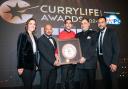 The Sultan Tandoori team receiving the award from Lord Karan Bilimoria, founder of Cobra Beer and awards host Camilla Tominey.