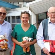 Jim Whitehead (R) has supplied over 32,000 teddy bears to Addenbrooke's Hospital over the past 20 years. He's pictured with Paediatric health play specialist, Sophie Barber (middle) and secretary of Cambridge lodge, Tony Barrios (L).