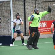 Emma Bentley and Jules Griffiths watch as Tracey Jago makes a save for St Ives.