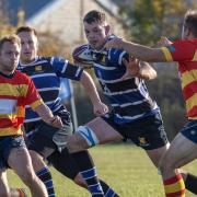 St Ives\' man of the match, Ollie Raine, bursts through a gap.