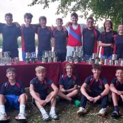 Huntingdon Boat Club Juniors team pose with their trophies.