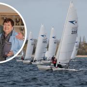 Mark Aldridge accepts his prize from Judith Black at the Gill Dart 15 Winter TT at Grafham Water Sailing Club.