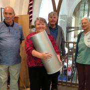 Members of the Great Paxton History Society and bell ringers helped to lay the time capsule in the church.