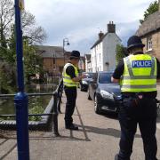 The County Council is also applying for Civil Parking Enforcement powers to allow them to enforce inconsiderate parking. Pictured: Police issuing parking tickets in St Neots.