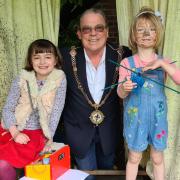 Cllr Alan Hooker with Ariadne and Isadora Vane, the granddaughters of Christopher Vane Percy, at Island Hall.