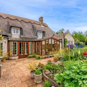 Three Horseshoes Cottage is a Grade II listed home