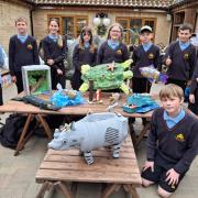 The Sawtry Village Academy pupils with their sculptures at Johnsons of Old Hurst.