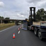 A lorry has shed its load on the A1 near St Neots.