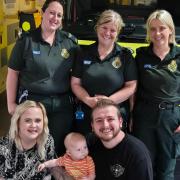 Paramedic Sarah-Jayne Parsons, Senior Emergency Medical Technician Bethany Walesby, and Emergency Care Assistant Amy Rengert with Christian and Jessica Roberts and baby Luca. 