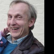 Dr Peter Williams pictured with his first granddaughter Ella 14 years ago.