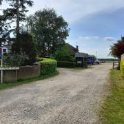 Existing access road off London Road to Tudor Place and Folly Farm stables, in Yaxley.