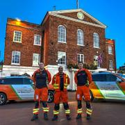 Huntingdon Town Hall bathed in orange light.