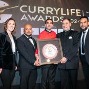 The Sultan Tandoori team receiving the award from Lord Karan Bilimoria, founder of Cobra Beer and awards host Camilla Tominey.