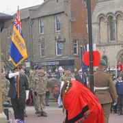 Karl Brockett laying a wreath at the war memorial in Huntingdon.