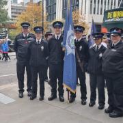 Cambridgeshire cadets and two leaders with flag