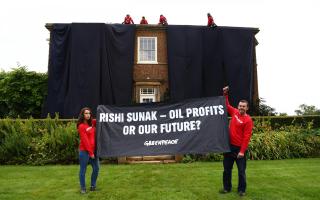 Greenpeace activists blanketed the home in black fabric in protest over Rishi Sunak’s North Sea oil announcement earlier this week