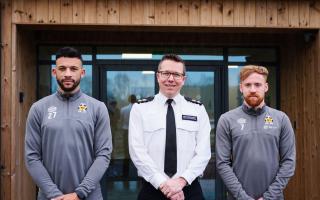 Chief Superintendent Jon Hutchinson with players James Brophy and Macauley Bonne.