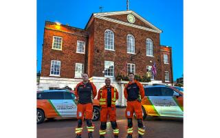 Huntingdon Town Hall bathed in orange light.