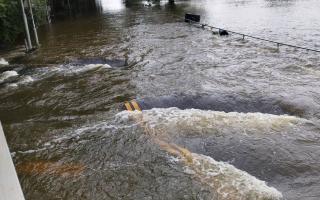 Little Paxton Bridge, on the B1041 Mill Lane, has been fully submerged since Friday.