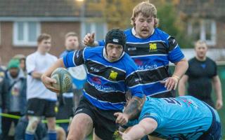 Rees Burns round the last defender to complete his hat-trick.