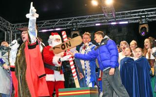 Sol Scott turned the Christmas lights on alongside the Mayor and Mayoress of Huntingdon, Cllr Karl Brockett and Julie Brockett.