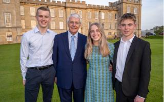 Sir John Major pictured with students from Kimbolton School.