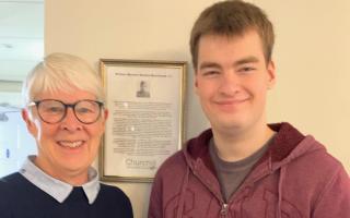 Josh Pace, 'Chief Can Crusher' for the Huntingdon Cromwell Rotary Club, with his certificate.