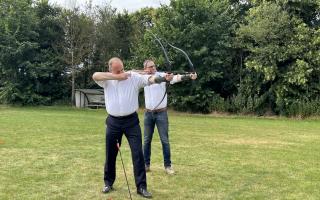 Sir Ed Davey and Ian Sollom having a go at some archery today.